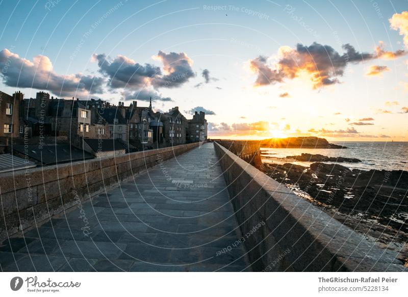 Sunset with clouds in beautiful village Wall (barrier) Town France travel Tourism Brittany evening mood Vacation & Travel Landscape Exterior shot Sky Deserted