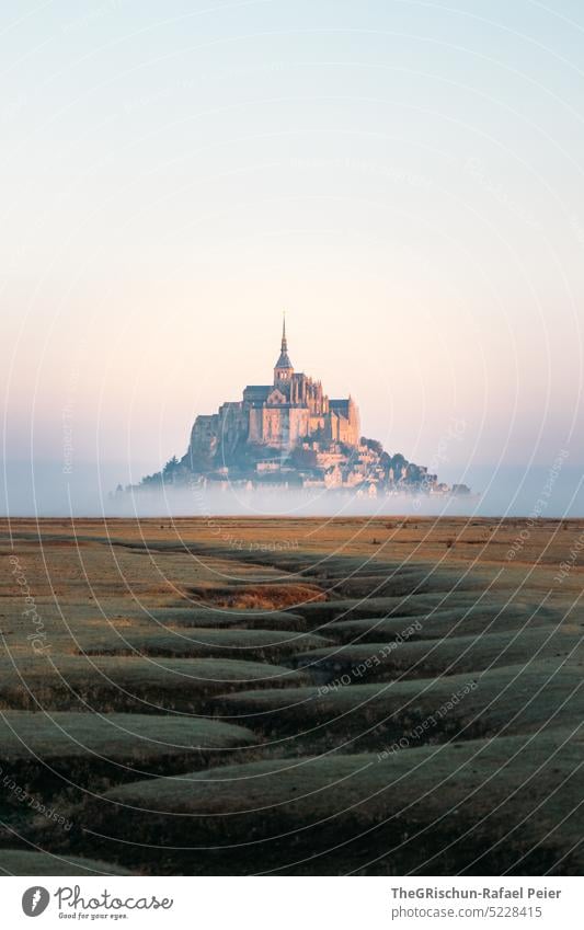 Dry river bed in front of Mont Saint Michel Meadow Blue sky Grass Landscape mont saint michel Mont St. Michel France Landmark Tourism Tourist Attraction