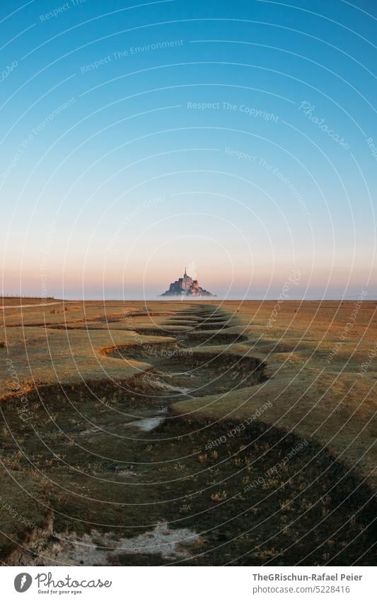 Dry river bed in front of Mont Saint Michel Meadow Blue sky Grass Landscape mont saint michel Mont St. Michel France Landmark Tourism Tourist Attraction