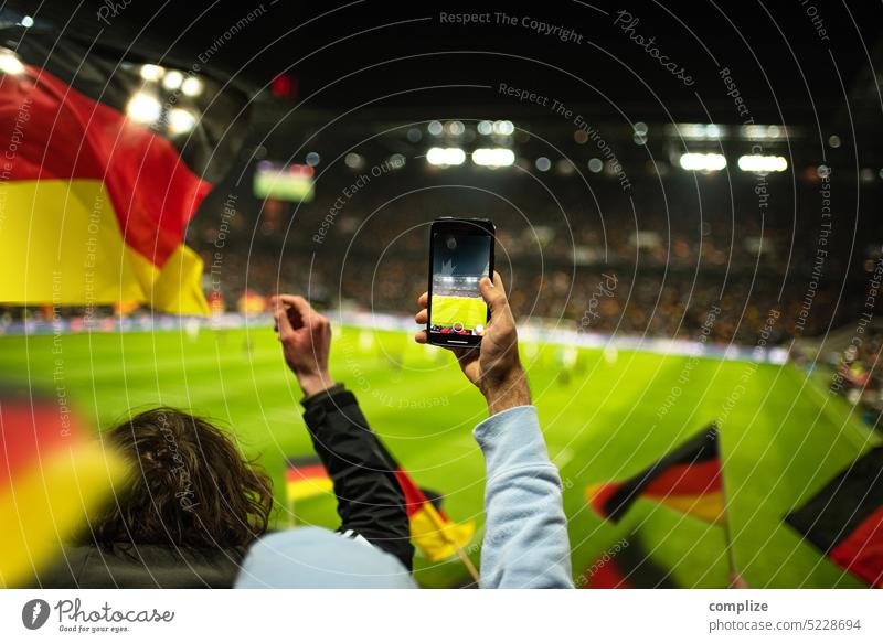 Football match in stadium Germany fans with German flags EM World Cup Football stadium Exterior shot Applause UEFA European Championship Fan Moody Joy Emotions