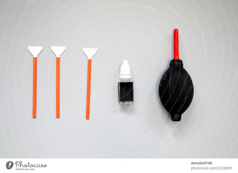 Sensor cleaning kit, Layout of cleaning kit for digital cameras, cleaning sensor with small brush and airbomb. Copy space for text in the middle equipment lens