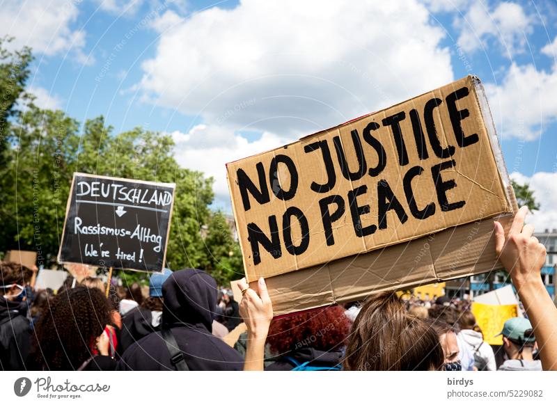 demonstration against racism in germany and all over the world.protest signs at a demonstration against racism . Everyday Racism Germany Skin color Origins