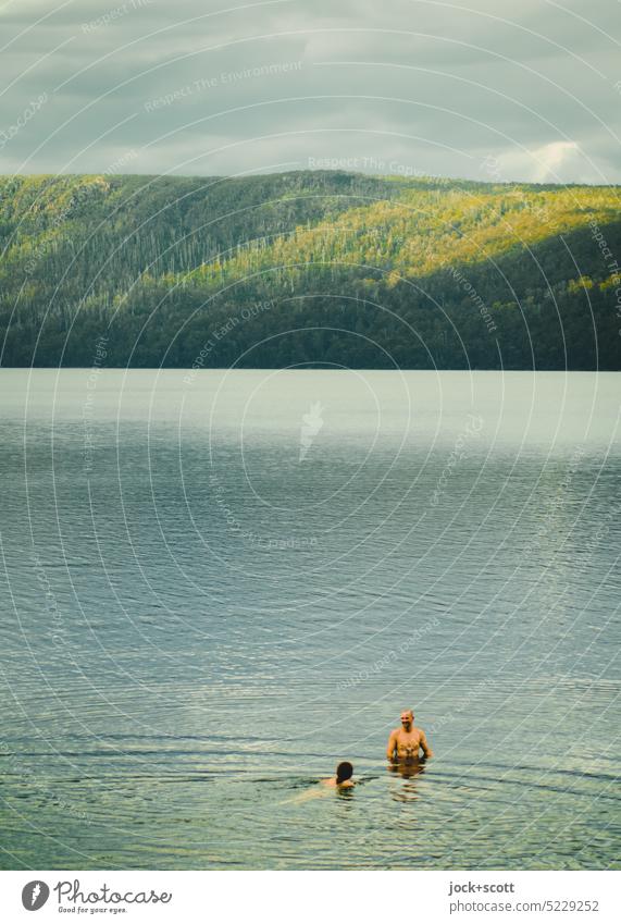 a young couple swimming in Lake St. Clair, the deepest lake in Australia Couple Relationship Affection Harmonious Together Nature Romance Idyll Lovers Trust Man