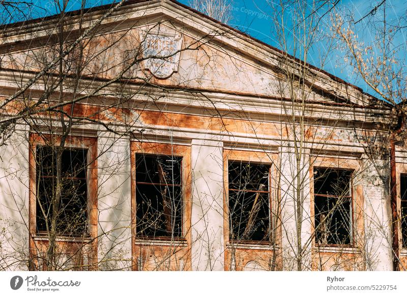 Abandoned Ruined Old Village School Building In Chernobyl Resettlement Zone. Belarus. Chornobyl Catastrophe Disasters. Dilapidated House In Belarusian Village. Whole Villages Must Be Disposed. Radioactivity Zone