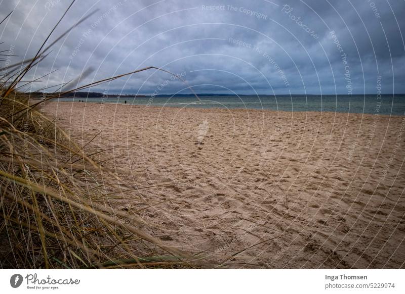 Dark clouds are gathering on the coast of Weissenhäuser Strand. Beach white houses beach Ocean Baltic Sea Marram grass Sky Nature Landscape Clouds Sand