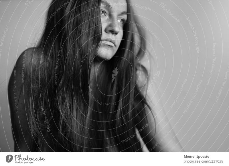 Woman with long hair looks into the distance Long-haired Looking sad Meditative thoughts Looking away Observe portrait Feminine Face Emotions Human being