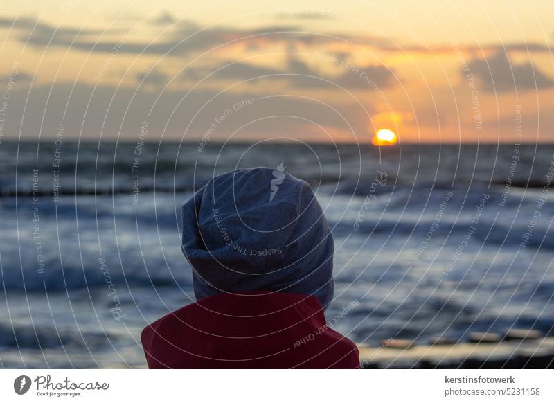 View of the setting sun over the sea Sun Sunset Evening Ocean Sky Dusk Clouds Water Horizon Light Blue Vacation & Travel Waves coast Nature Colour photo