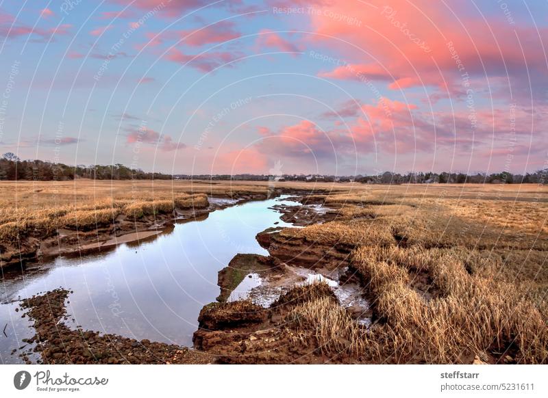 Sunset sky over the marsh and Sesuit Creek in East Dennis in winter dunes sand dune riverway Cape Cod Massachusetts sunset pink sky sunny day small town quaint