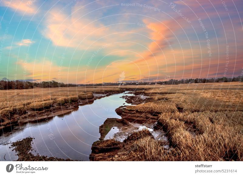 Sunset sky over the marsh and Sesuit Creek in East Dennis in winter dunes sand dune riverway Cape Cod Massachusetts sunset pink sky sunny day small town quaint