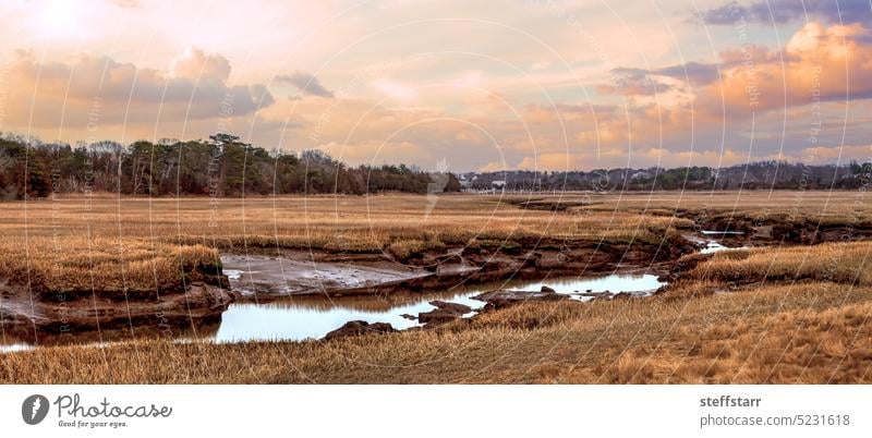 Sunset sky over the marsh and Sesuit Creek in East Dennis in winter dunes sand dune riverway Cape Cod Massachusetts sunset pink sky sunny day small town quaint