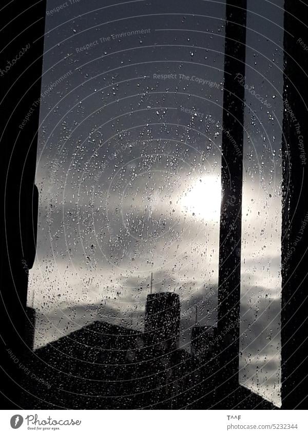 Drops on the window pane - view from the hospital room to the roofs in the rainy evening sun Window View from a window Rain Drops of water Window pane