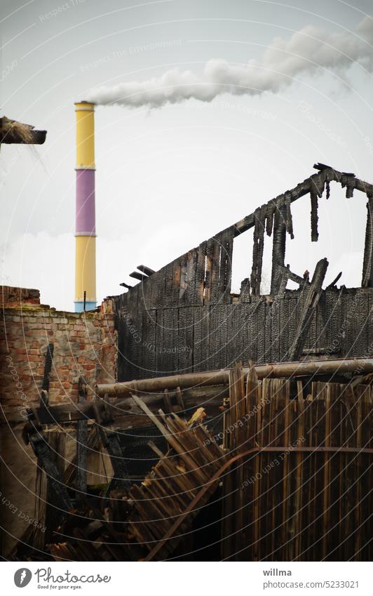 Burnt down house, behind it the colorful chimney of Chemnitz burnt Burnt out Ruin outline Chimney Smoke Shack house fire domestic fire Decline Heat