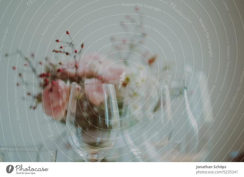 Wine glasses on the table, bouquet of flowers in the background wine glasses Bouquet Pink Red Yellow pastel Glasses White Subdued colour pretty Spring