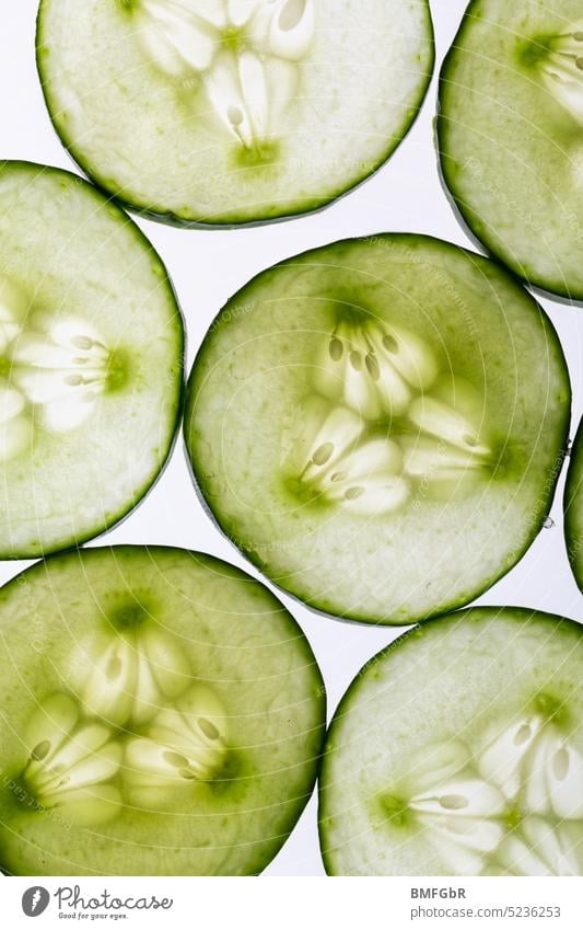 Cucumber slices backlit Slices of cucumber Cucumbers Backlight shot Back-light vegan food Vegan diet Vegetarian diet vegetarian Organic produce organic