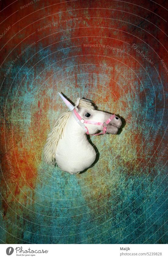 unicorn in the spotlight Colour colourful Fantastic myth Mythology Blue Deserted Horse Multicoloured Colour photo Art Creativity Green Studio shot Fairy tale