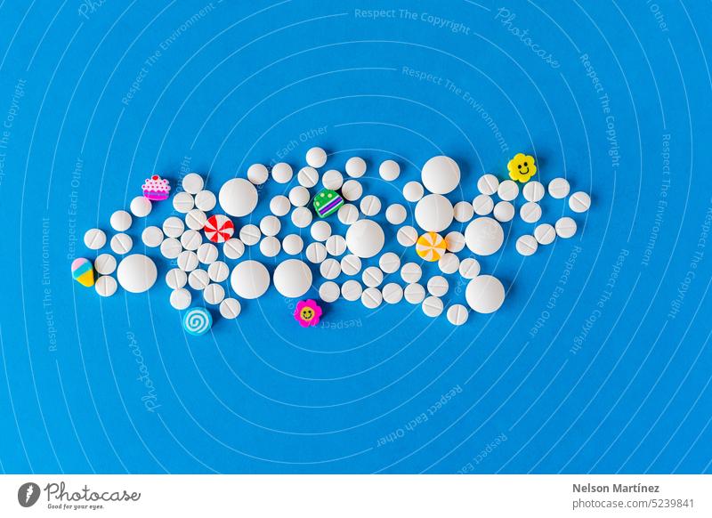 Many rounded pills and funny colored figures smile tablet vitamin therapy sick depression help addiction problem antidepressant top medication psychology happy