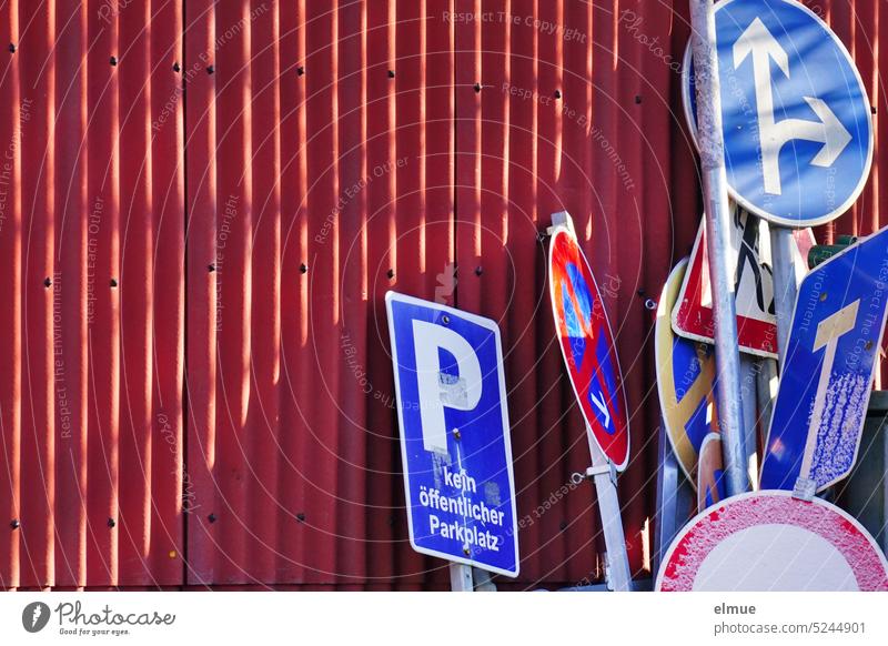 various traffic signs leaning against a red corrugated metal wall Road sign Traffic signs Corrugated iron wall Corrugated sheet iron Collection Warehouse Blog