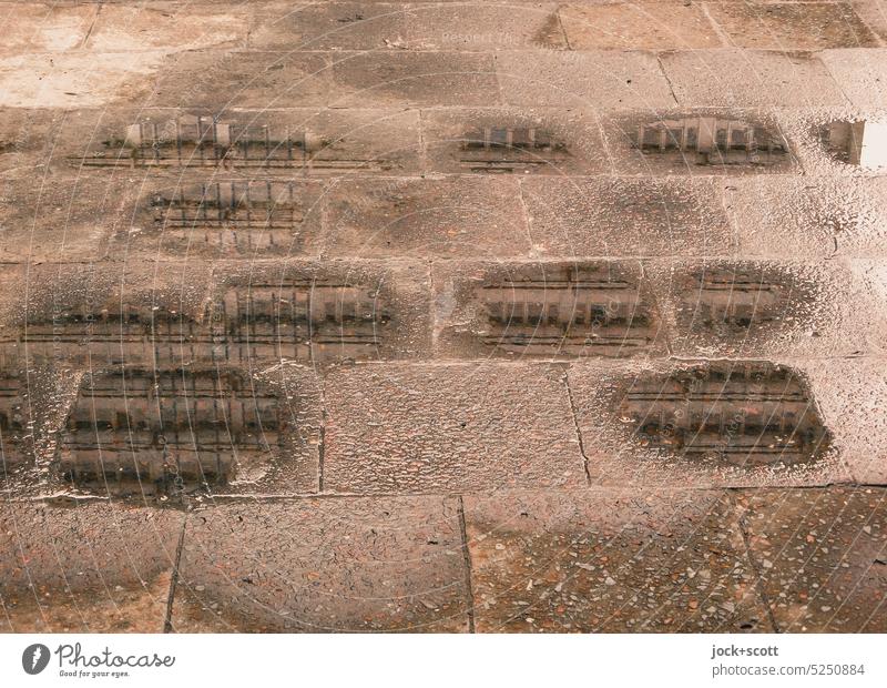 small puddles reflect big building Sidewalk Paving tiles Puddle Reflection Lanes & trails Wet Facade puddle mirroring after the rain Water puddle Abstract