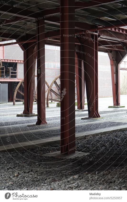 Rusty steel support pillars in a courtyard at shaft XII of the Zollverein colliery in Essen in the Ruhr area in North Rhine-Westphalia in Germany piers prop