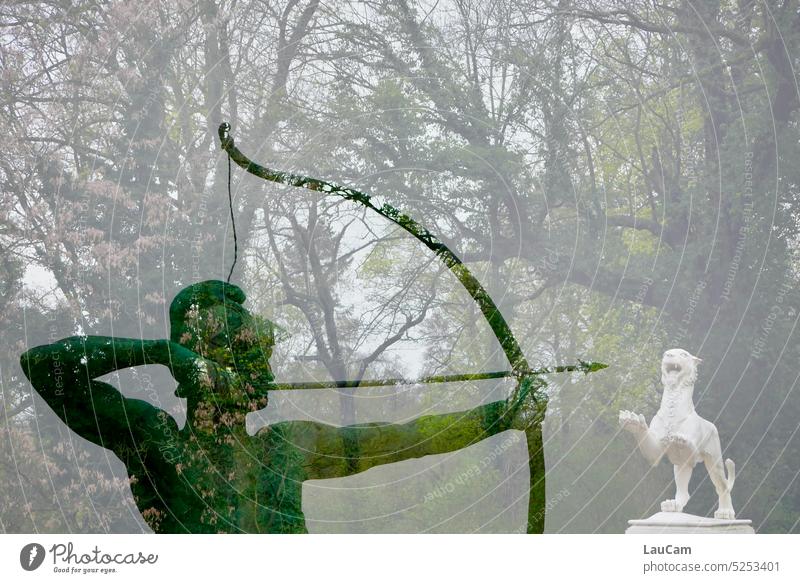 From another time - unerringly in the castle park Archer white lion Statues arrow and bow Arrow Hunting Hunting scene trees Forest Park Castle grounds Aim