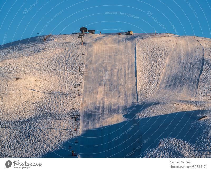 Ski slope during sunset on mountain slope in Alpe D'Huez ski resort - France alp alpe d huez alpe d'huez alpe d'huez le signal alpine alps architecture building