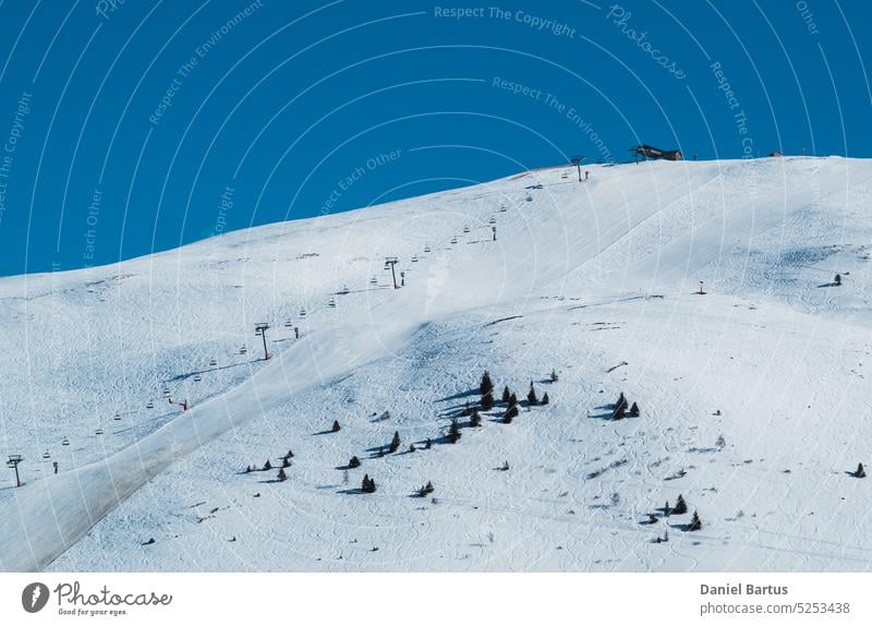 Ski slope on mountain slope in Alpe D'Huez ski resort - France alp alpe d huez alpe d'huez alpe d'huez le signal alpine alps architecture building chair cold