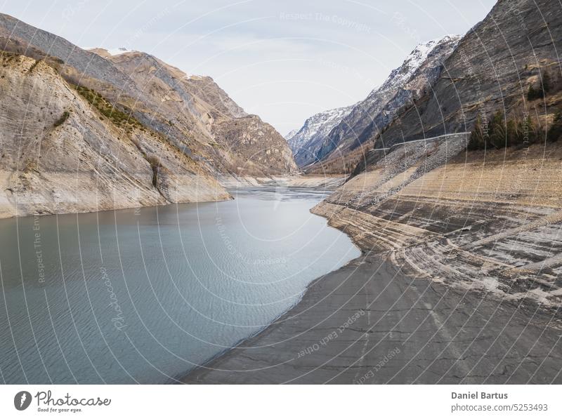 Panoramic drone shot of low water on Lac Chambon in French Alps active alpes alps alps mountains alps summer background barrage beautiful blue sky chambon