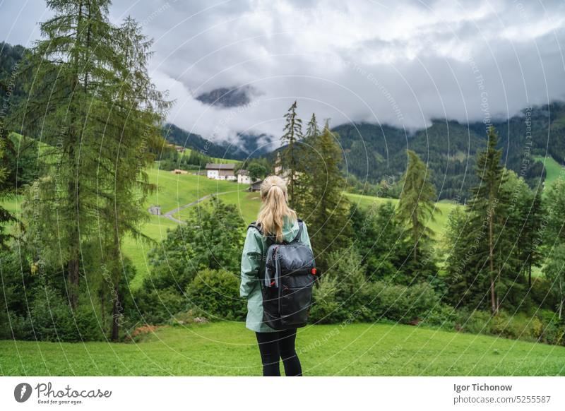 Woman enjoy the view of Val di Funes valley in the Dolomites, Santa Maddalena touristic village, Dolomites, Italy, Europe dolomites italy funes santa maddalena