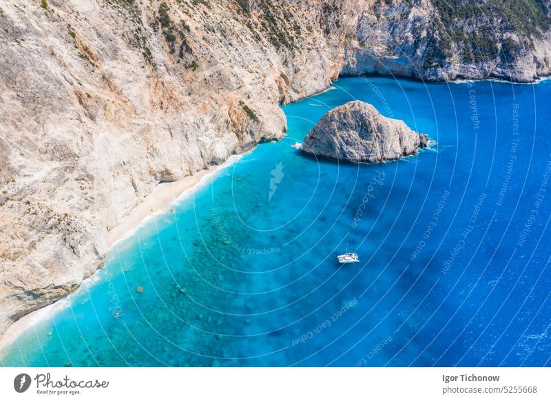 Aerial shots of famous tourist location of paradise beach in Lefkada, Greece. Luxury yacht boat in Porto Katsiki legendary cliffs and views of breathtaking seascapes