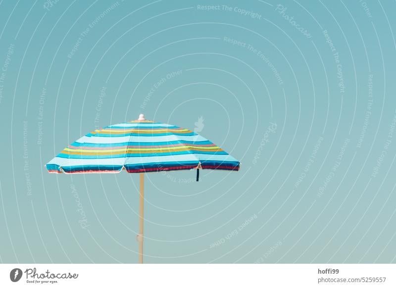 Parasol with rainbow stripes against blue sky parasols Cloudless sky Blue Summer Beautiful weather Sky Beach Sunlight shade dispenser Sunshade Blue sky Striped