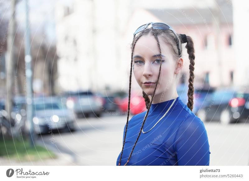 Fashion girl with cool hairstyle and blue fishnet shirt out and about in the city portrait individuality Creativity Freedom raver scene raver girl techno music