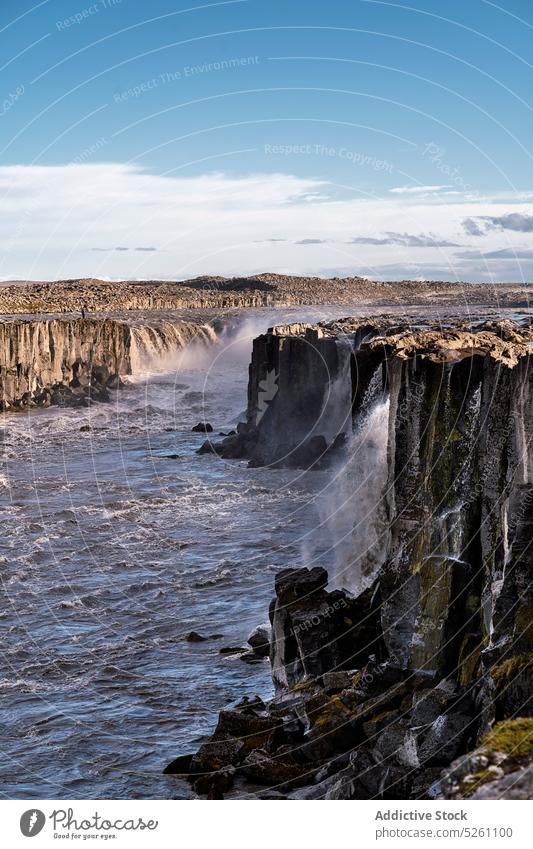 Amazing view of waterfall in rocky cliff scenery landscape river nature picturesque iceland europe selfoss jokulsa fjollum tranquil majestic wild natural