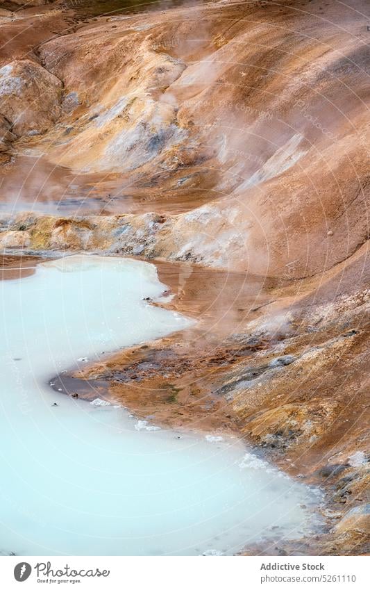 Sulfur spring on slope of clay hill volcanic lava steam geothermal source nature sulfur iceland europe krafla leirhnjukur active hot environment area landscape