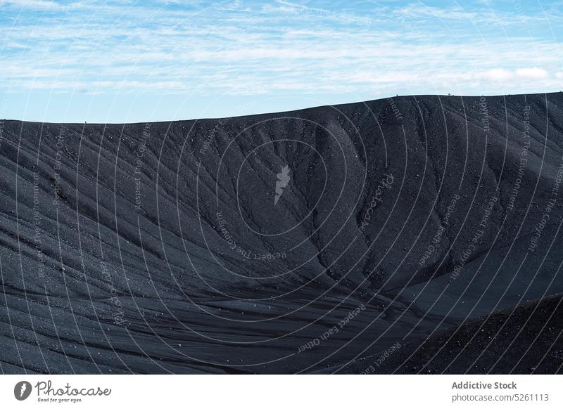 Amazing view of black crater cloudy blue sky nature volcanic scenery geology rough texture environment iceland europe hverfjall tephra uninhabited location