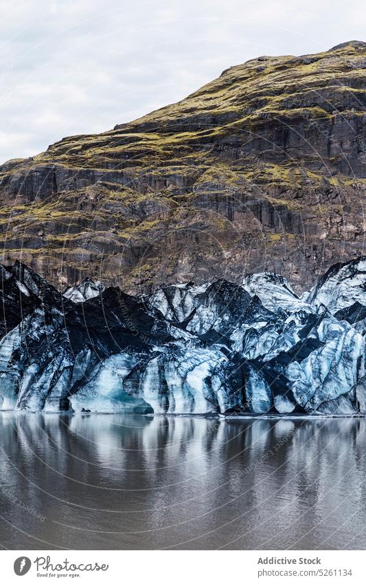 Amazing view of glacier near water snow cold winter nature landscape aqua climate frost iceland europe solheimajokull river lake travel sea adventure season