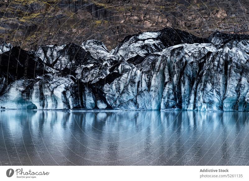 Amazing view of glacier near water snow cold winter nature landscape aqua climate frost iceland europe solheimajokull river lake travel sea adventure season