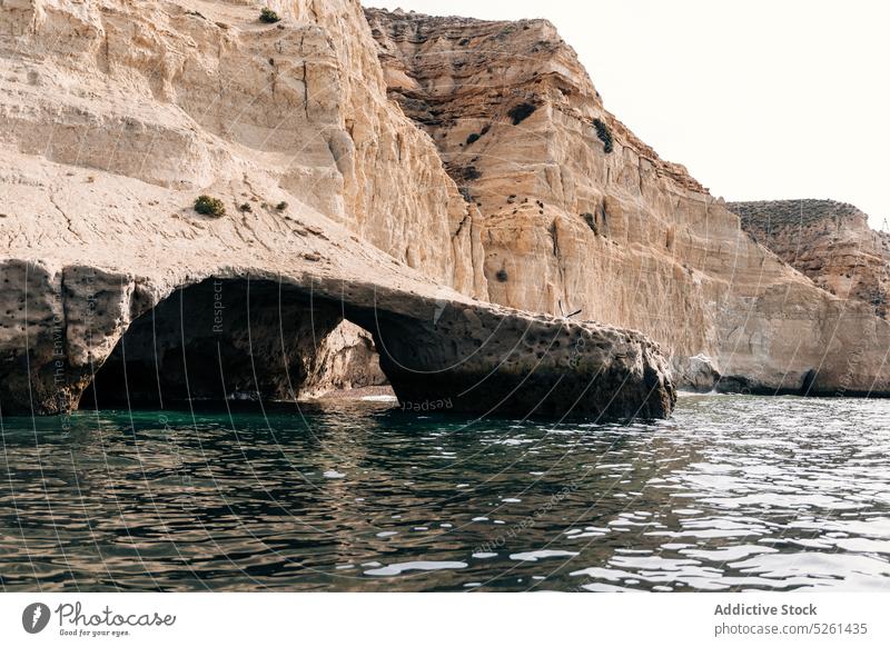 Rocky formations near rippling sea cliff nature rocky ocean picturesque seascape water scenery scenic landscape massive ripple coast seashore seaside cabo raso