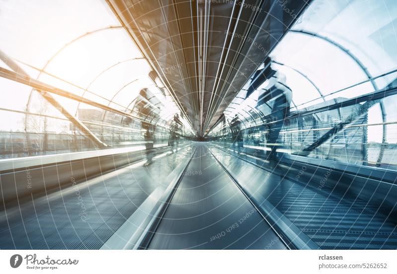 futuristic airport skywalk with blurred passengers architecture visitors move business corridor Frankfurt people trade fair group cologne munich germany messe