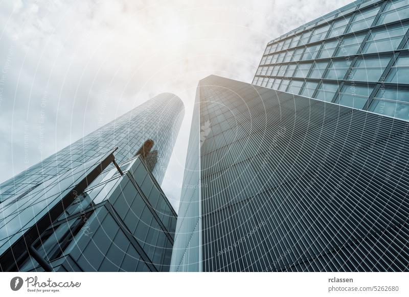 Facade of skyscrapers blue toned apartment architecture bank business office office building downtown frankfurt urban big city highrise complex houses canyon