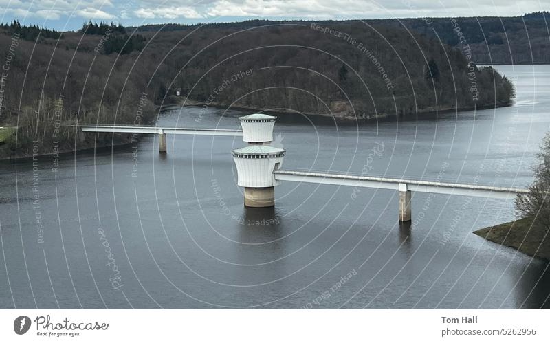 Water towers at a water reservoir watertower water tower Hydroelectric  power plant powerant cloudy outside futuristic