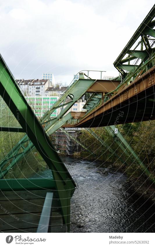 Steel girders of the track of the Wuppertal suspension railroad Over the Wupper river in springtime in the city center of Wuppertal in the Bergisches Land region of North Rhine-Westphalia, Germany