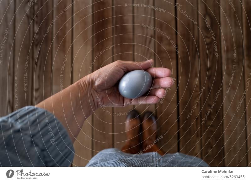 Woman in blue dress holds blue egg in hand Egg Blue Food Nutrition Close-up Colour photo Organic produce Breakfast Vegetarian diet Eating Healthy Delicious