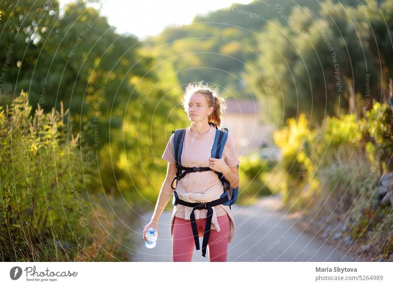 Young woman hiking on mountains in Europe. Concepts of adventure, extreme survival, orienteering. Backpacking hike women young europe backpacking mountaineer