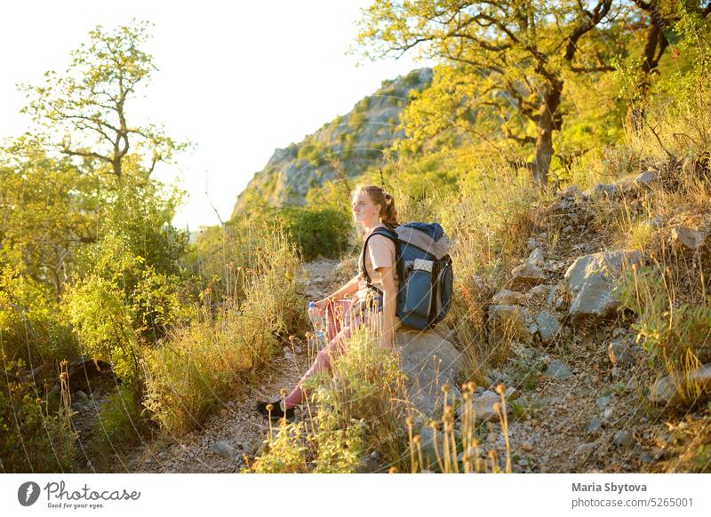 Young woman hiking in countryside. Concepts of adventure, extreme survival, orienteering. Backpacking hike women young mountain europe backpacking mountaineer