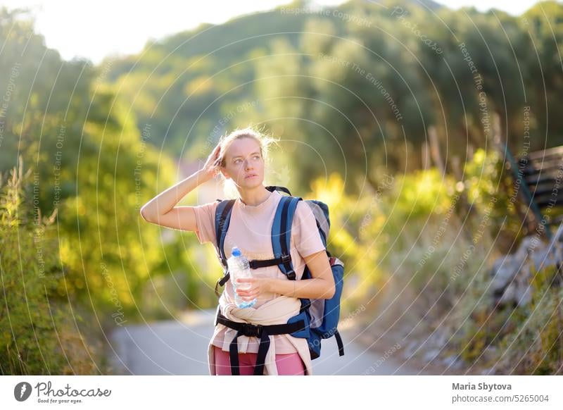 Young woman hiking on mountains in Europe. Concepts of adventure, extreme survival, orienteering. Backpacking hike women young europe backpacking mountaineer