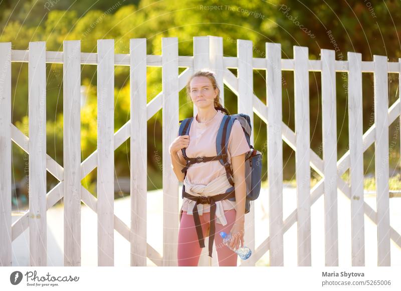 Portrait of young woman hiking in forests and mountains of Europe. Concepts of adventure, extreme survival, orienteering. Solo travel. portrait europe