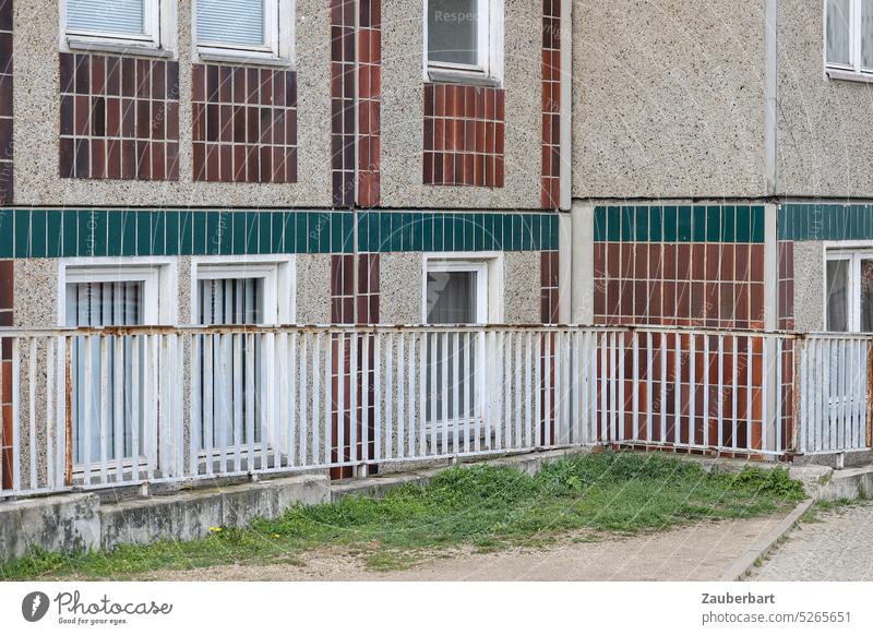 Facade slab building from the sidewalk, with railing, in Berlin-Mitte Prefab construction tiles Window dwell Flat (apartment) housing GDR Middle off Close-up