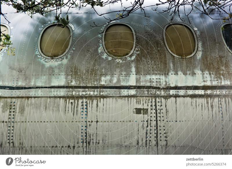 airplane Airplane Passenger plane Window aviation Tourism voyage Airport Old Metal Tin Aluminum Aluminium air traffic Parking lot Scrapyard discarded Stud