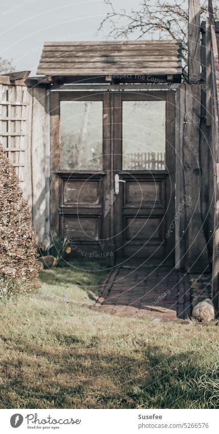 An old door in a garden Old Garden Wood Goal Entrance Wooden door Structures and shapes Closed Vantage point