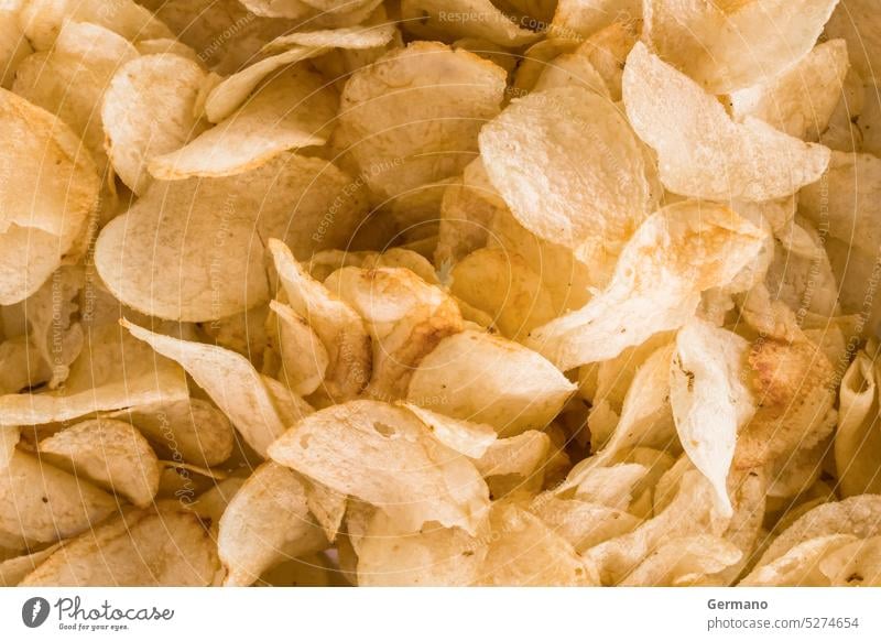 Crispy chips golden pattern appetizer background calories close closeup concept crisps crispy crunchy delicious diet eat eating event fast fat food fried